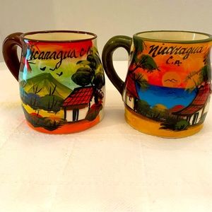 Beautiful hand painted mugs from Nicaragua C.A one brown handle one green handle